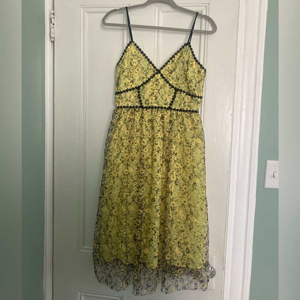 Yellow and black lace cocktail dress